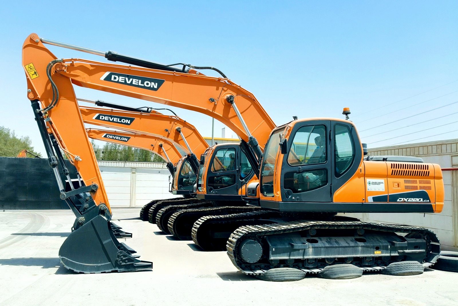 A row of RANCO tracked excavators ready for hire