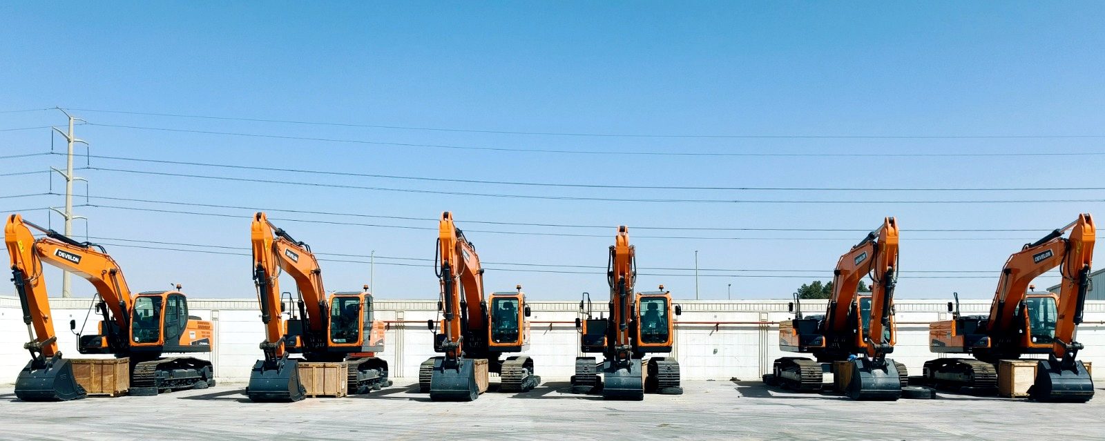 Six RANCO excavators lined up in the yard